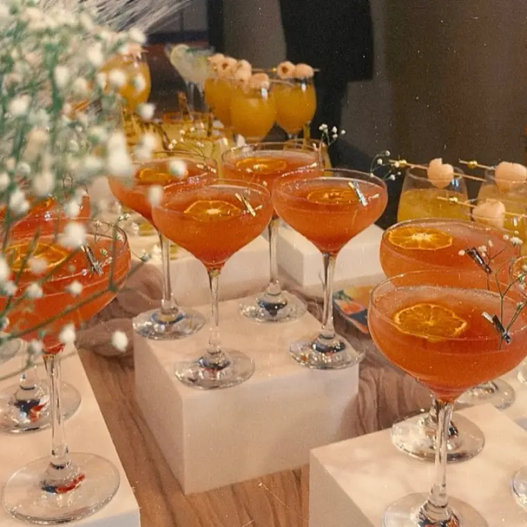 A row of garnished handcrafted Club Citrine mocktails
