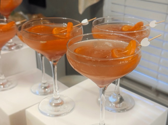 Row of citrus mocktails on white risers at a Calgary event